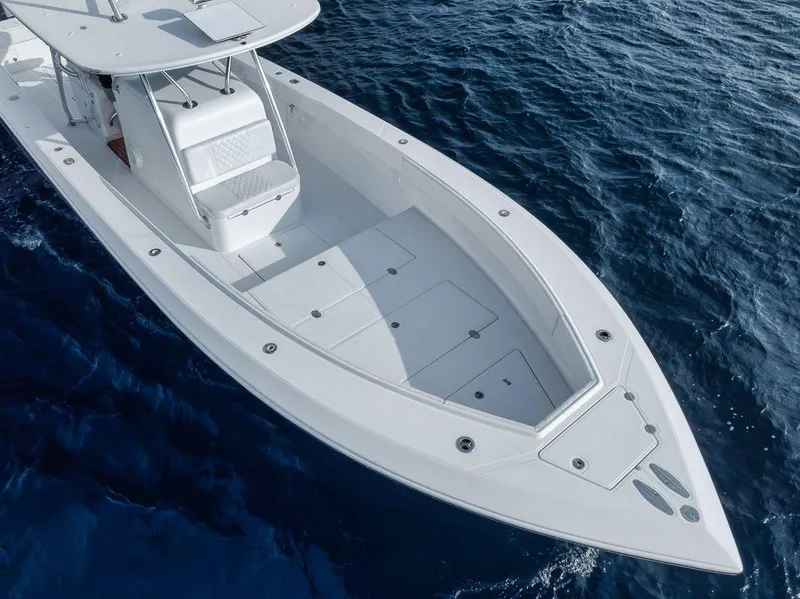 Slide: The Image of 2010 Bahama 41 boat on open water, showcasing sleek design and spacious deck. - 23
