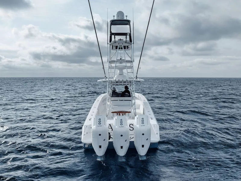 Slide: The Image of Bahama 41 boat, 2010 model, cruising on open ocean under cloudy skies. - 24