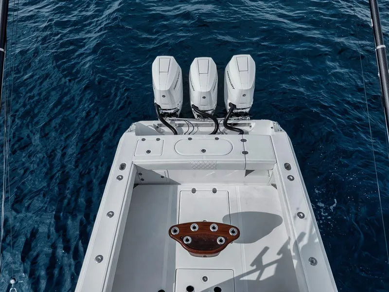Slide: The Image of Bahama 41 boat, 2010 model, with triple outboard engines on open sea. - 26