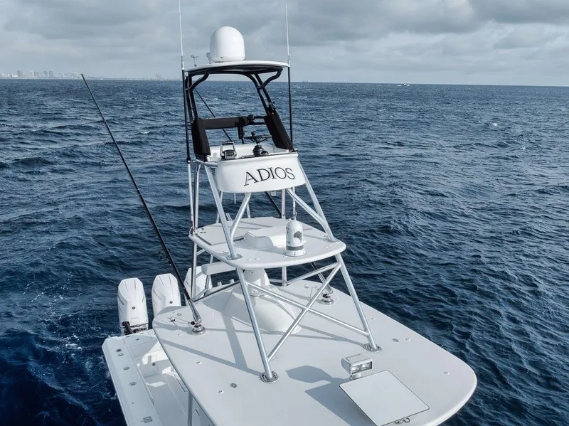 Slide: The Image of Bahama 41 boat on ocean, 2010 model, with tower labeled "ADIOS." - 32