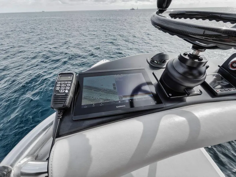 Slide: The Image of Boat helm with navigation system and radio on a 2010 Bahama 41. - 35