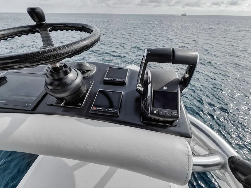 Slide: The Image of Control panel of 2010 Bahama 41 boat with ocean view. - 36