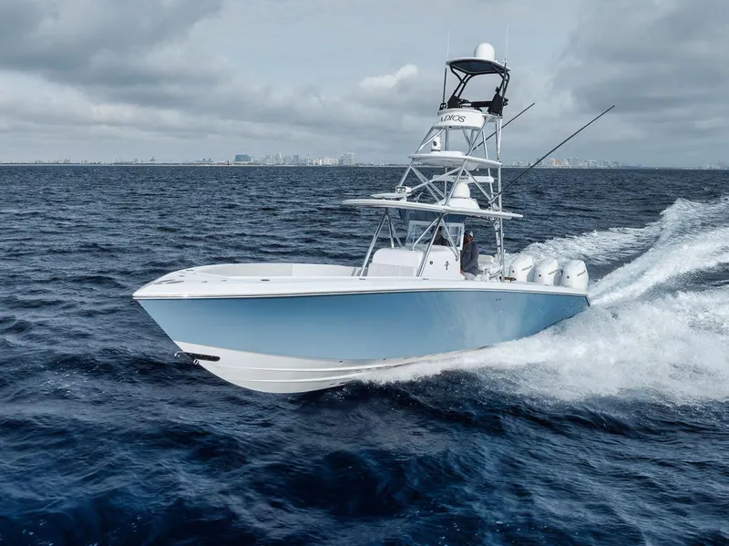 Slide: The Image of 2010 Bahama 41 boat cruising on open ocean waters. - 4