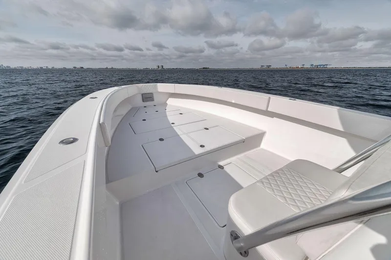 Slide: The Image of 2010 Bahama 41 boat on open water, featuring spacious deck and seating. - 42