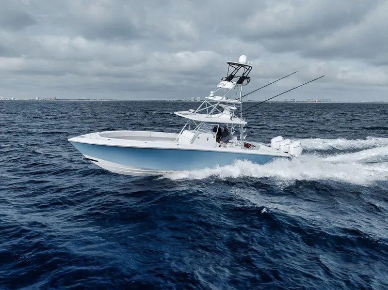 Slide: The Image of Bahama 41 boat cruising on open sea under cloudy skies, 2010 model. - 7