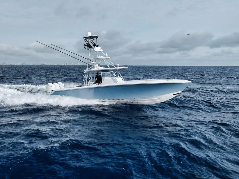 Slide: The Image of 2010 Bahama 41 boat cruising on open ocean under cloudy sky. - 8