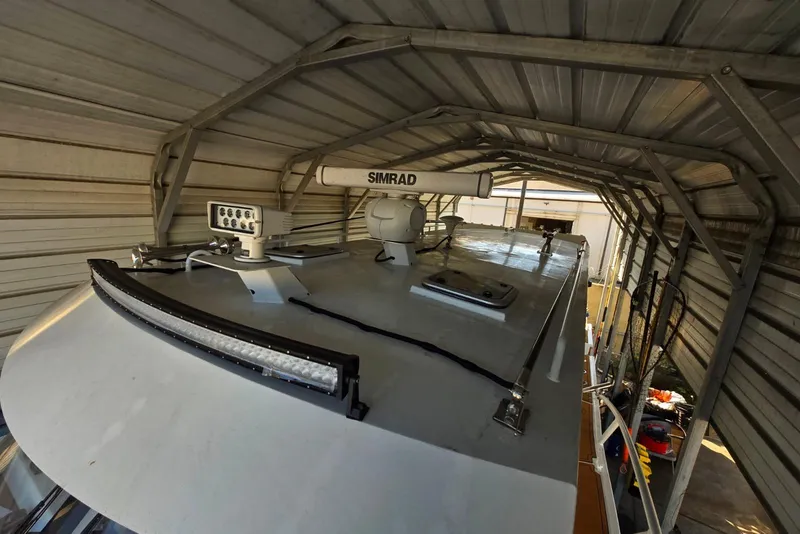 Slide: The Image of Rooftop view of 2025 Custom Boat 34 with radar and lighting equipment. - 11