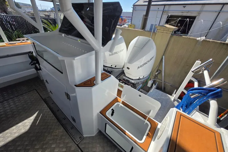 Slide: The Image of 2025 Custom Boat 34 with dual Mercury engines, spacious deck, and modern amenities. - 21