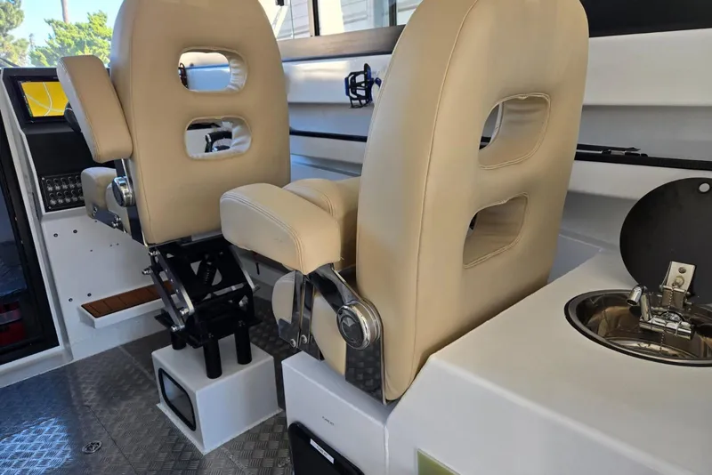 Slide: The Image of Interior of 2025 Custom Boat 34 with beige seats and modern amenities. - 26