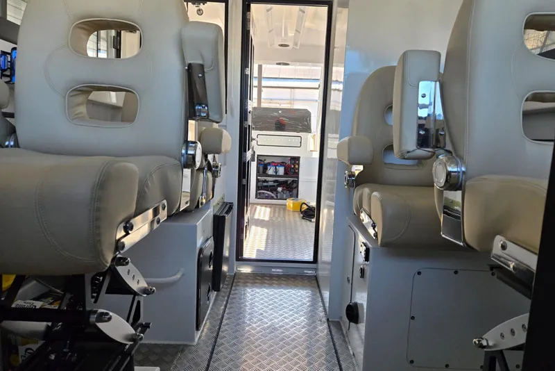 Slide: The Image of Interior of 2025 Custom Boat 34 with modern seating and sleek design. - 28