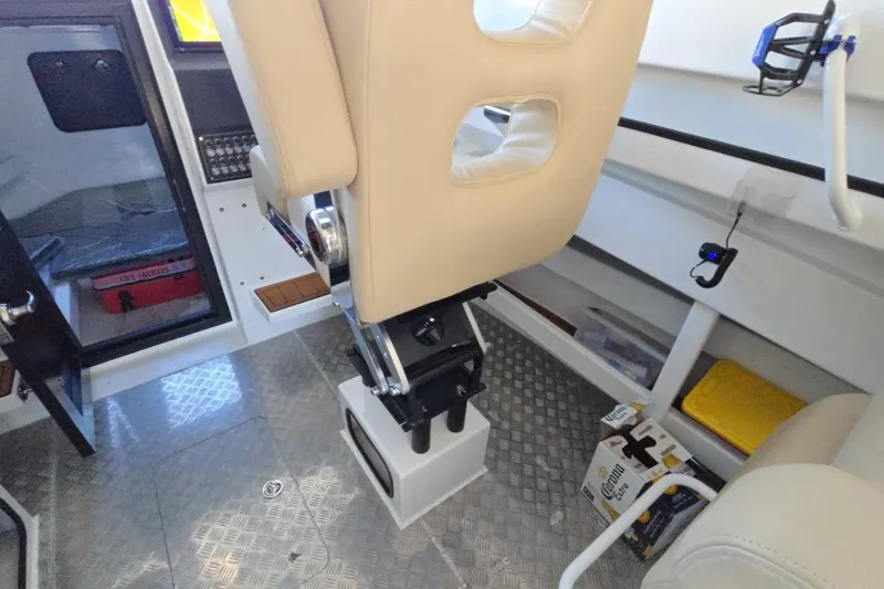 Slide: The Image of Interior of 2025 Custom Boat 34 with beige seating and modern controls. - 30