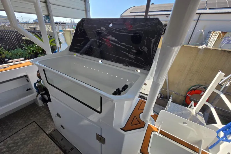 Slide: The Image of Custom Boat 34 (2025) with open storage compartment and modern design features. - 39