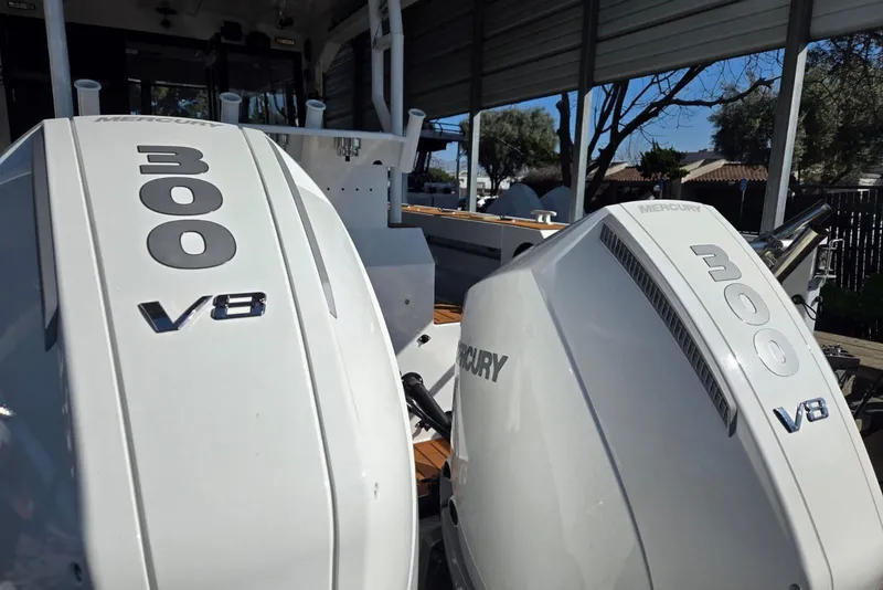 Slide: The Image of Twin Mercury 300 V8 engines on a 2025 Custom Boat model 34. - 42