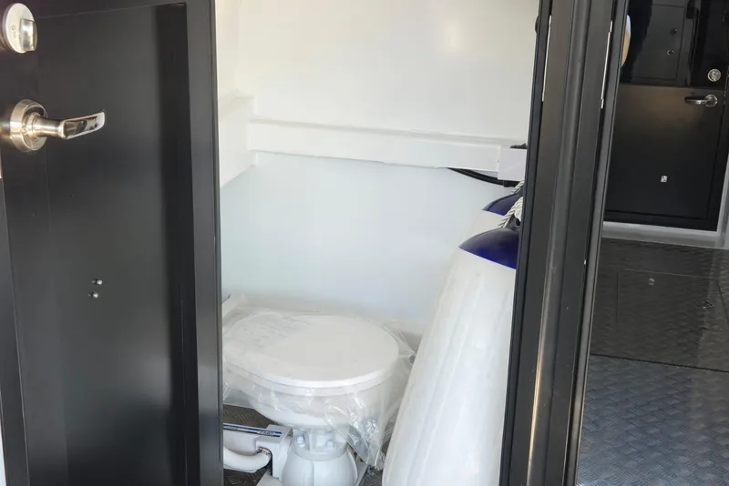 Slide: The Image of Interior of 2025 Custom Boat 34, featuring a compact bathroom with modern fixtures. - 45
