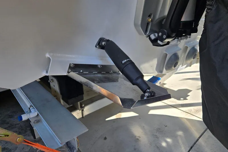Slide: The Image of 2025 Custom Boat 34 with trim tab and hydraulic actuator detail. - 46