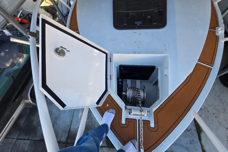 Slide: The Image of Custom Boat 34 (2025) anchor locker with chain and deck hatch. - 5