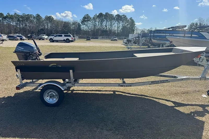 Slide: The Image of 2026 G3 Gator Tough 1548 VBW boat on trailer, parked outdoors under clear sky. - 6