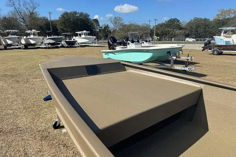 Slide: The Image of 2026 G3 Gator Tough 1548 VBW boat displayed outdoors with other boats. - 9