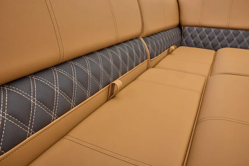 Slide: The Image of Luxurious tan and black leather seating in 2026 Ranger 223FC with diamond stitching. - 13