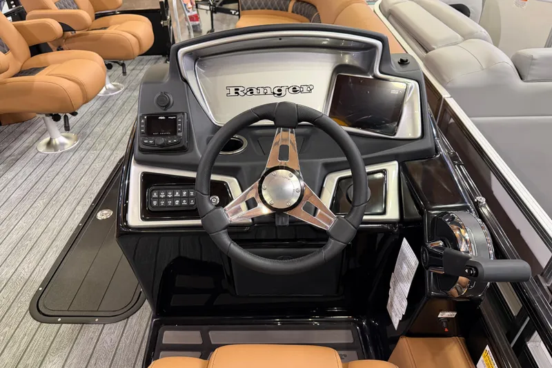 Slide: The Image of 2026 Ranger 223FC boat dashboard with steering wheel and control panel. - 6