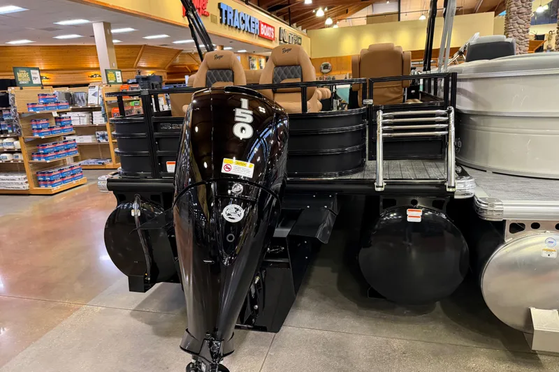 Slide: The Image of 2026 Ranger 223FC boat with 150 horsepower engine displayed indoors. - 8