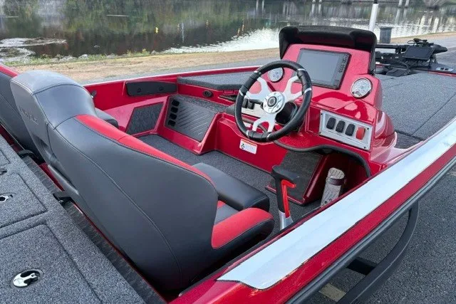 Slide: The Image of 2026 Nitro Z19 XL Pro boat interior with red and black seating, steering console, and dashboard. - 23