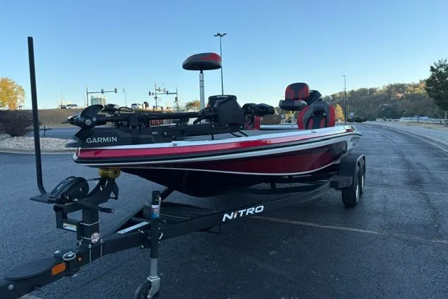 Slide: The Image of 2026 Nitro Z19 XL Pro boat on trailer, featuring Garmin equipment, parked outdoors. - 15