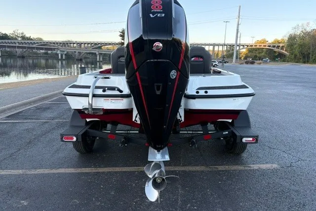 Slide: The Image of 2026 Nitro Z19 XL Pro boat with powerful outboard motor, parked near a scenic waterfront. - 9