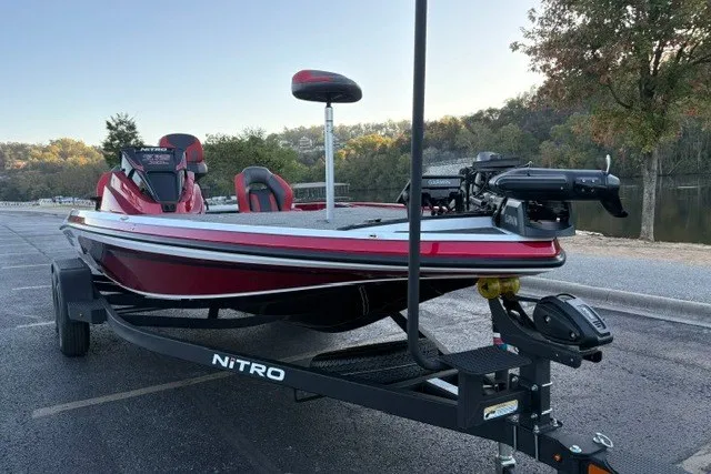 Slide: The Image of 2026 Nitro Z19 XL Pro boat on trailer, parked near a scenic lake. - 14