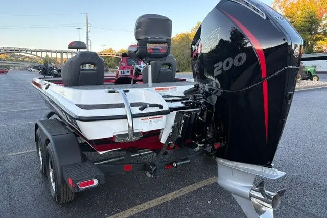 Slide: The Image of 2026 Nitro Z19 XL Pro boat with powerful 200 HP engine in parking lot. - 8