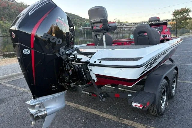 Slide: The Image of 2026 Nitro Z19 XL Pro boat with powerful Mercury engine, parked near a scenic river. - 10