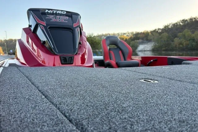 Slide: The Image of 2026 Nitro Z19 XL Pro boat with red accents and seating, set against a scenic backdrop. - 34