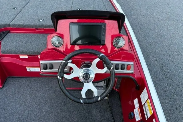 Slide: The Image of Red Nitro Z19 XL Pro 2026 boat dashboard with steering wheel and digital display. - 22