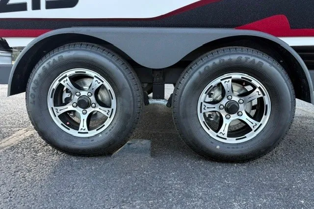 Slide: The Image of Dual wheels of a 2026 Nitro Z19 XL Pro on asphalt surface. - 57