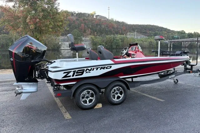 Slide: The Image of 2026 Nitro Z19 XL Pro boat on trailer, parked near a scenic river backdrop. - 13