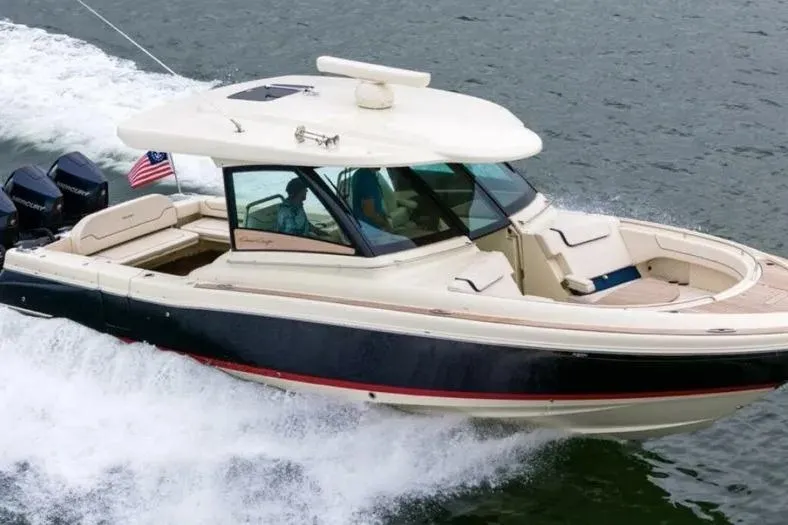 The Image of 2023 Chris-Craft Calypso 35 cruising on water, showcasing sleek design and powerful engines. - 0