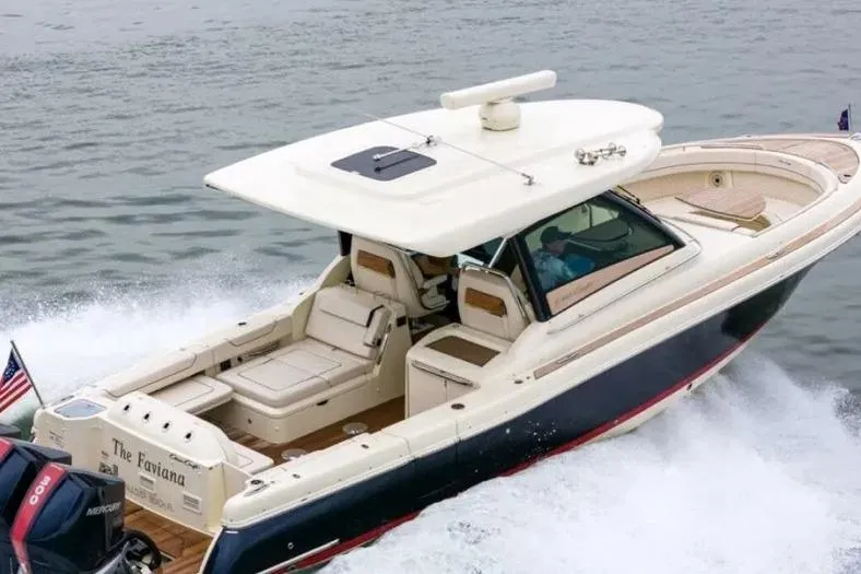 Slide: The Image of 2023 Chris-Craft Calypso 35 cruising on water, showcasing luxury design and performance. - 1