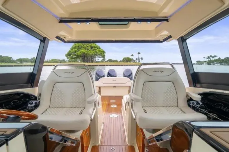 Slide: The Image of 2023 Chris-Craft Calypso 35 interior with luxurious seating and elegant design. - 14