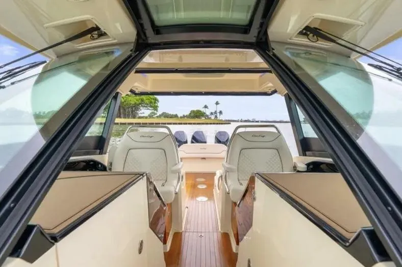 Slide: The Image of 2023 Chris-Craft Calypso 35 interior with luxurious seating and sleek design. - 15