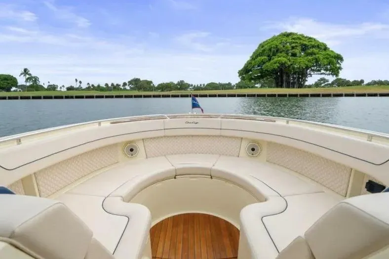 Slide: The Image of Luxurious 2023 Chris-Craft Calypso 35 boat interior with elegant seating and scenic water view. - 18