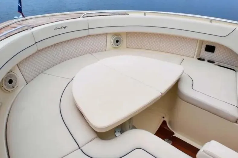 Slide: The Image of Luxurious seating area on 2023 Chris-Craft Calypso 35 boat, featuring elegant upholstery. - 19
