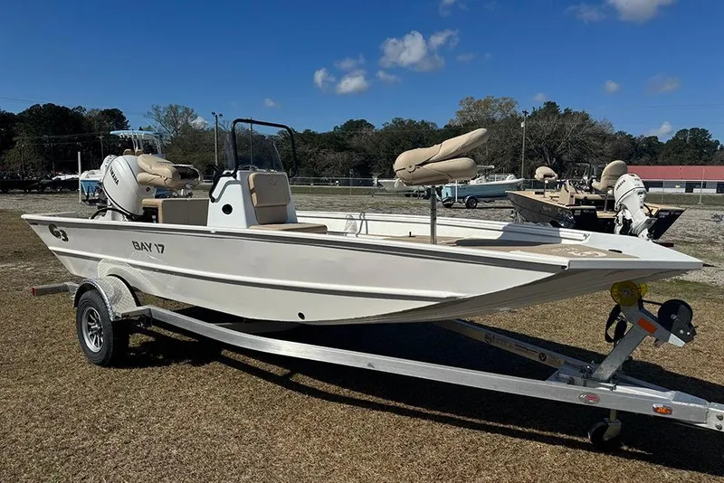 The Image of 2026 G3 Bay 17 boat on trailer under clear blue sky. - 1