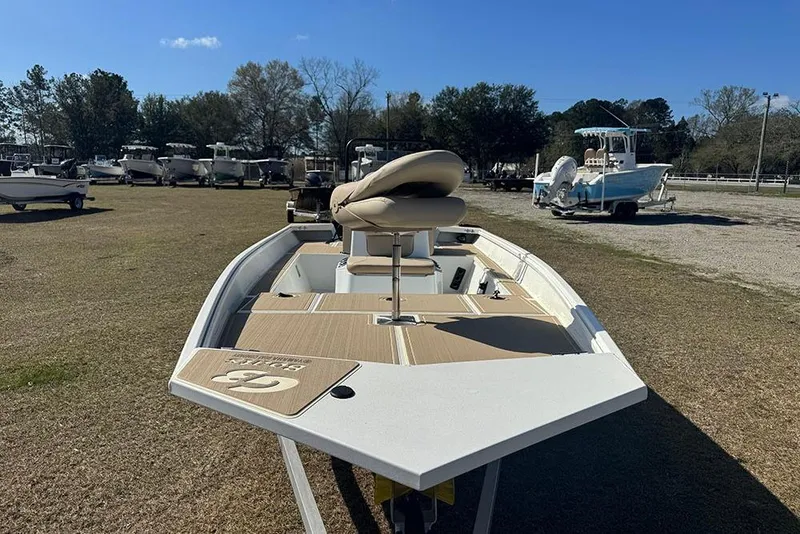 Slide: The Image of 2026 G3 Bay 17 boat on display in an outdoor setting with other boats. - 11