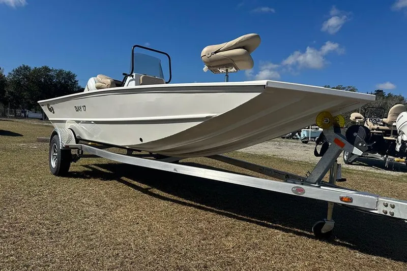 Slide: The Image of 2026 G3 Bay 17 boat on trailer, parked on grass under blue sky. - 12
