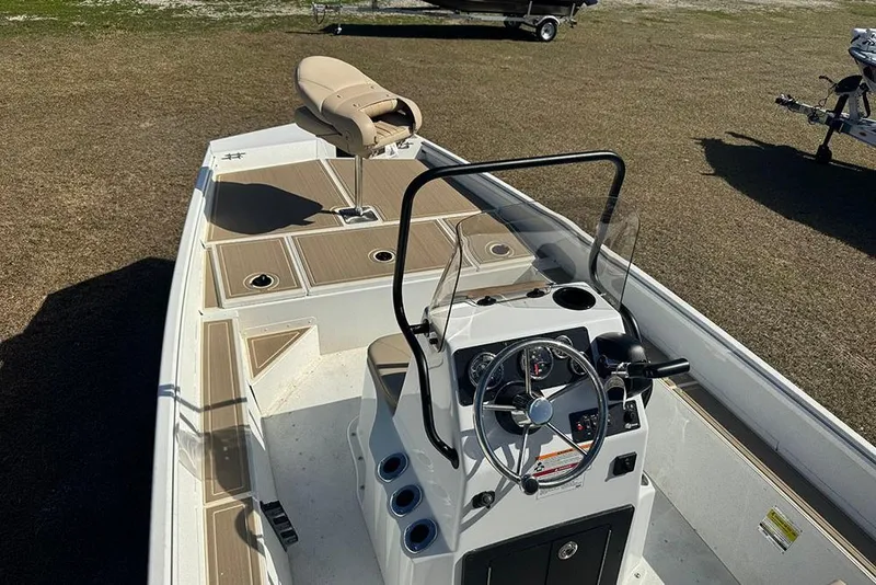 Slide: The Image of 2026 G3 Bay 17 boat interior with steering console and seating. - 13