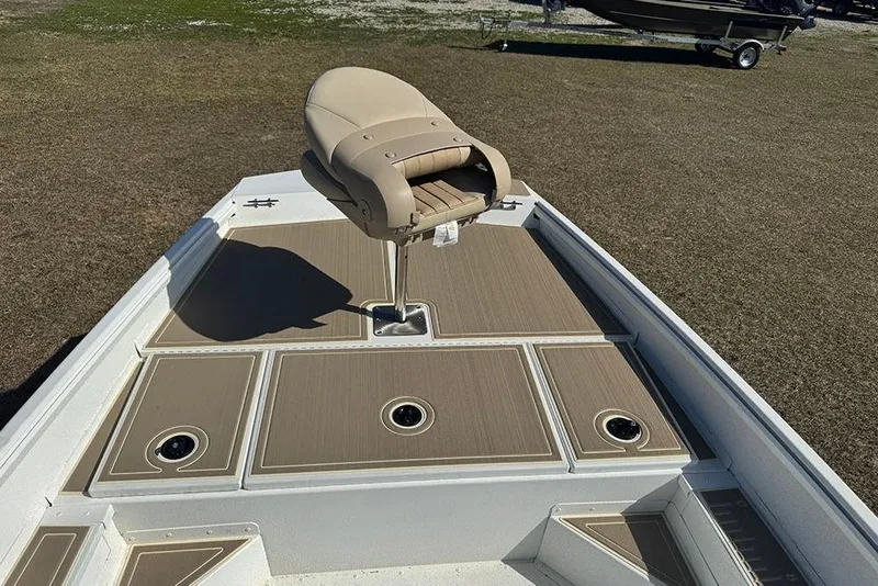 Slide: The Image of 2026 G3 Bay 17 boat deck with tan seat and storage compartments. - 14