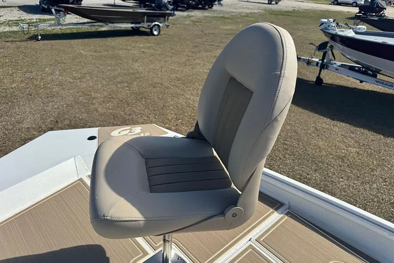 Slide: The Image of Boat seat on a 2026 G3 Bay 17, with trailers in the background. - 17