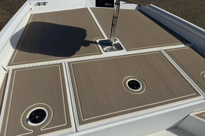 Slide: The Image of 2026 G3 Bay 17 boat deck with tan non-slip surface and seat mount. - 18