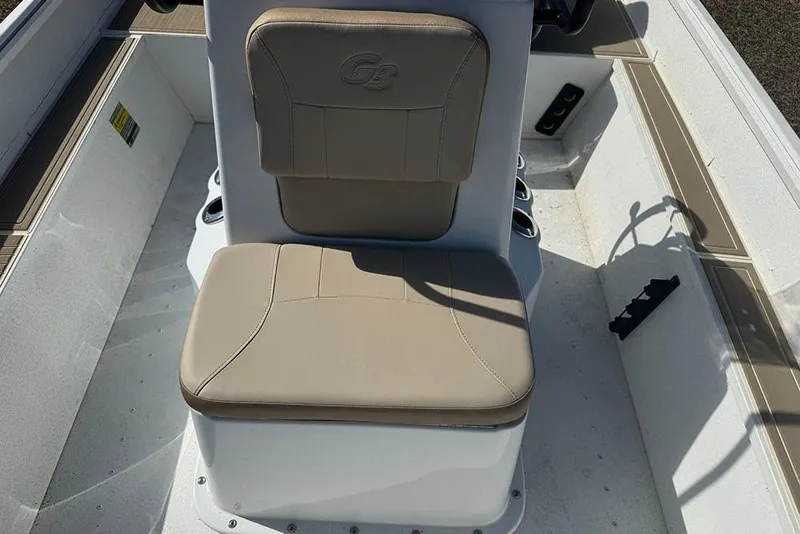 Slide: The Image of 2026 G3 Bay 17 boat seat with beige upholstery and integrated storage. - 20