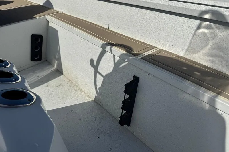 Slide: The Image of 2026 G3 Bay 17 boat interior with cup holders and shadowed steering wheel. - 23